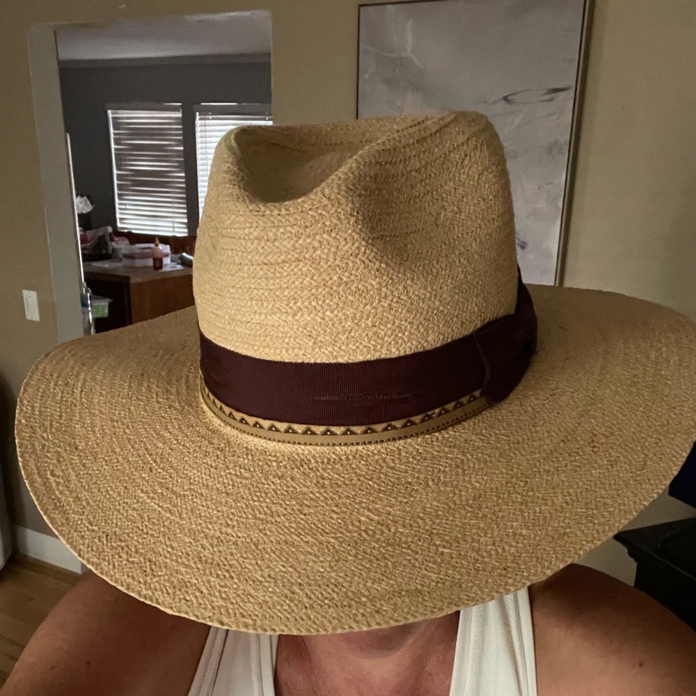 Straw sunhat with multiple ribbons.
